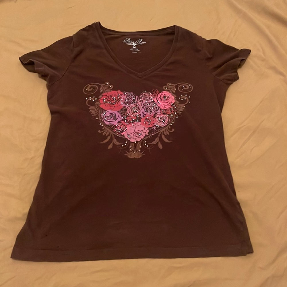 Brown short sleeve with flower bouquet print on the front.